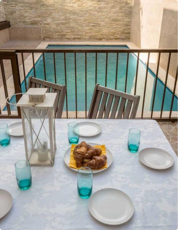 Table with chairs by the pool