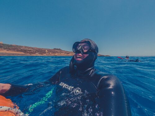 Freediver smiling as he surfaces