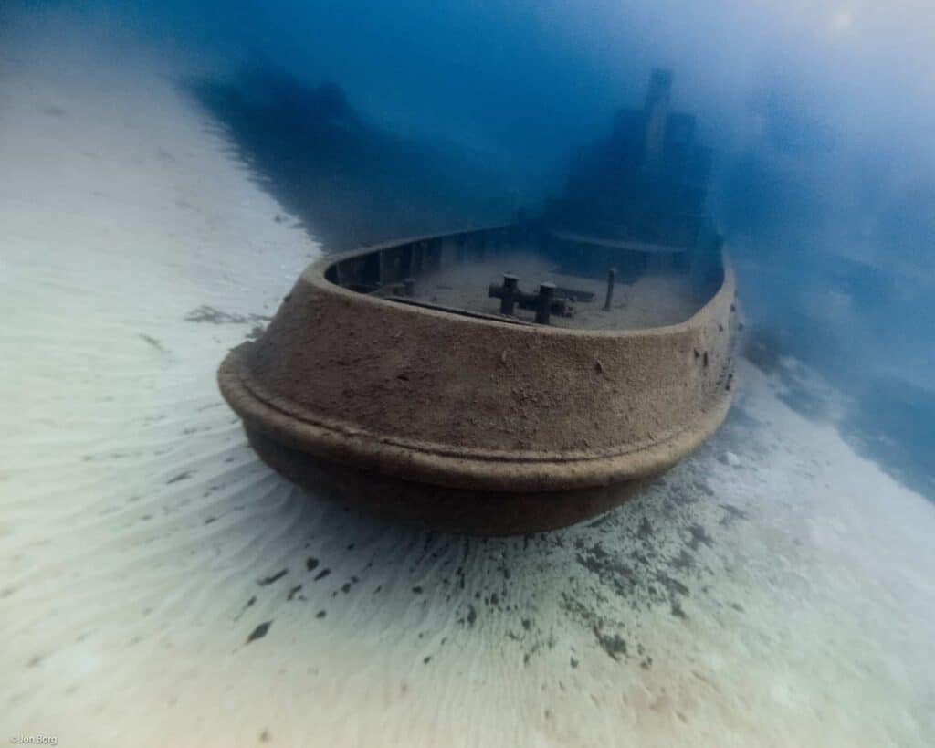 Stern of Tug 2 wreck sitting on sandy bottom