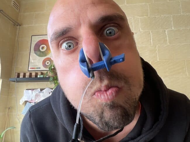 Freediving instructor Fabrice showing mouthfill using a nose clip