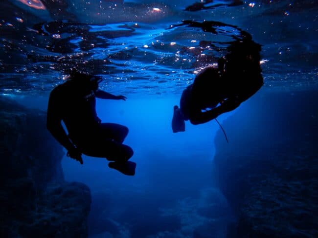 Two freedivers in the Xlendi Cave