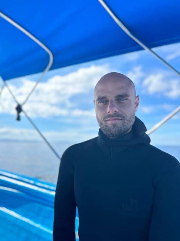 Deep MEd's owner and instructor, Fabrice Bonello Dupuis, smiling on a boat.